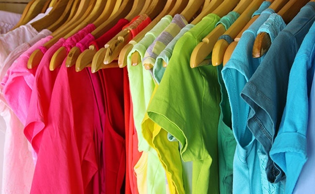 Colorful Clothes Hanging In Wardrobe Colorful Clothes Hanging In Wardrobe