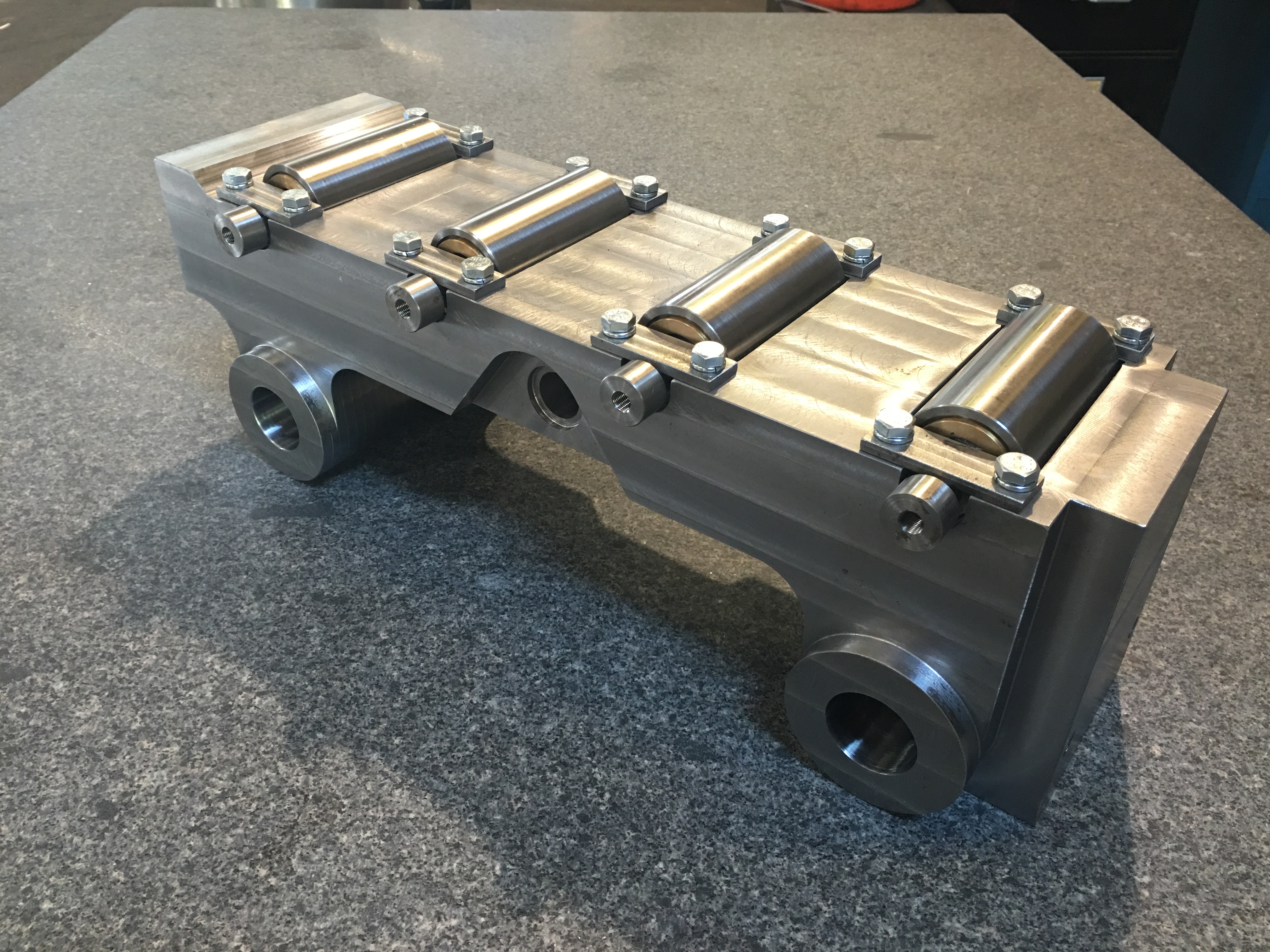 Industrial warehouse interior with equipment and machinery arranged on tables.