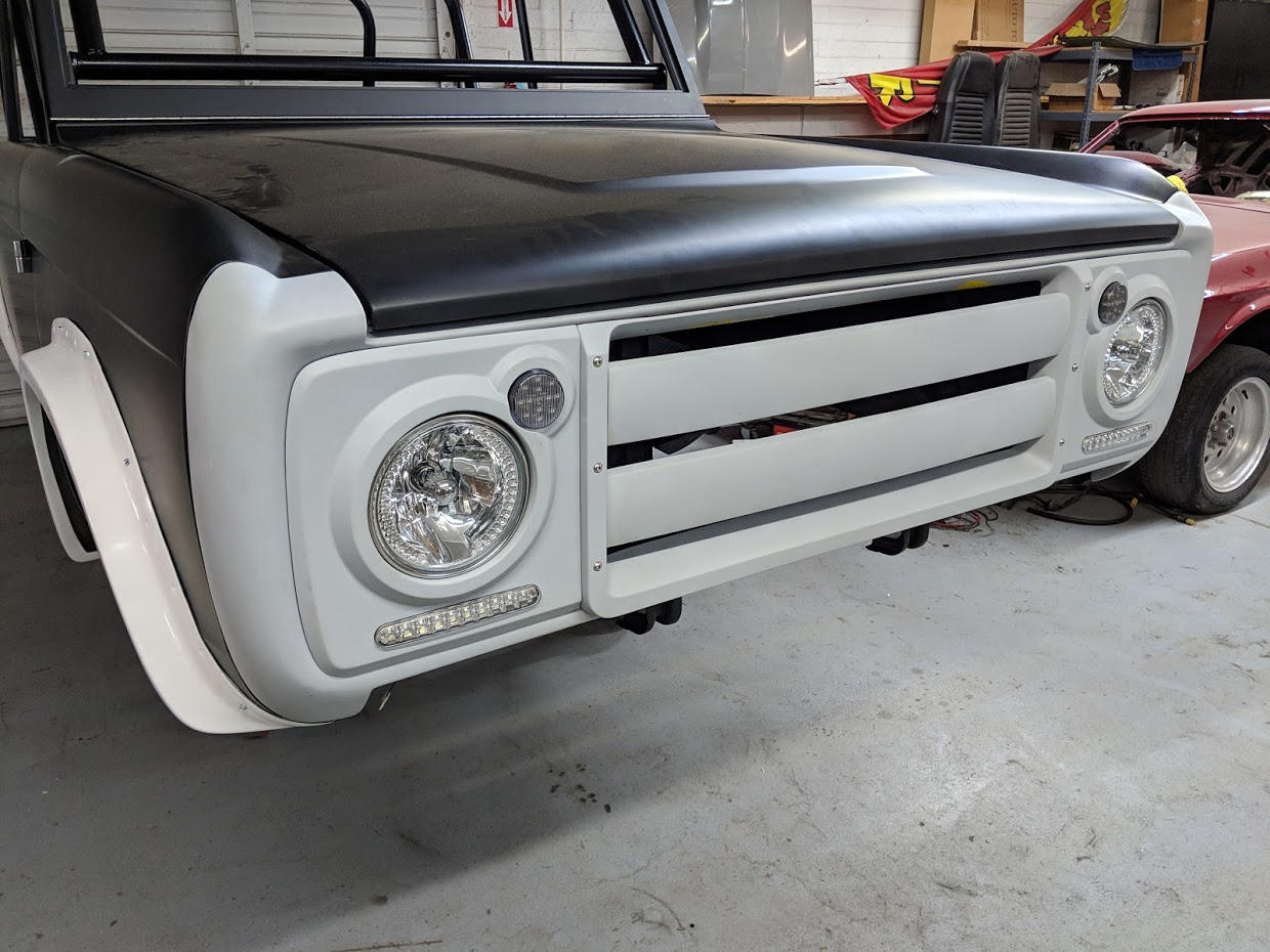 Headlight covers have round clear or amber puck lights and  bottom light bar are included. You supply your own round headlight bulbs.