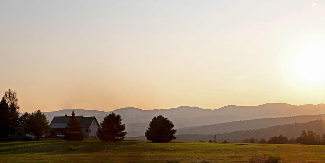The rolling hills and farmland of 
Vermont at sunset