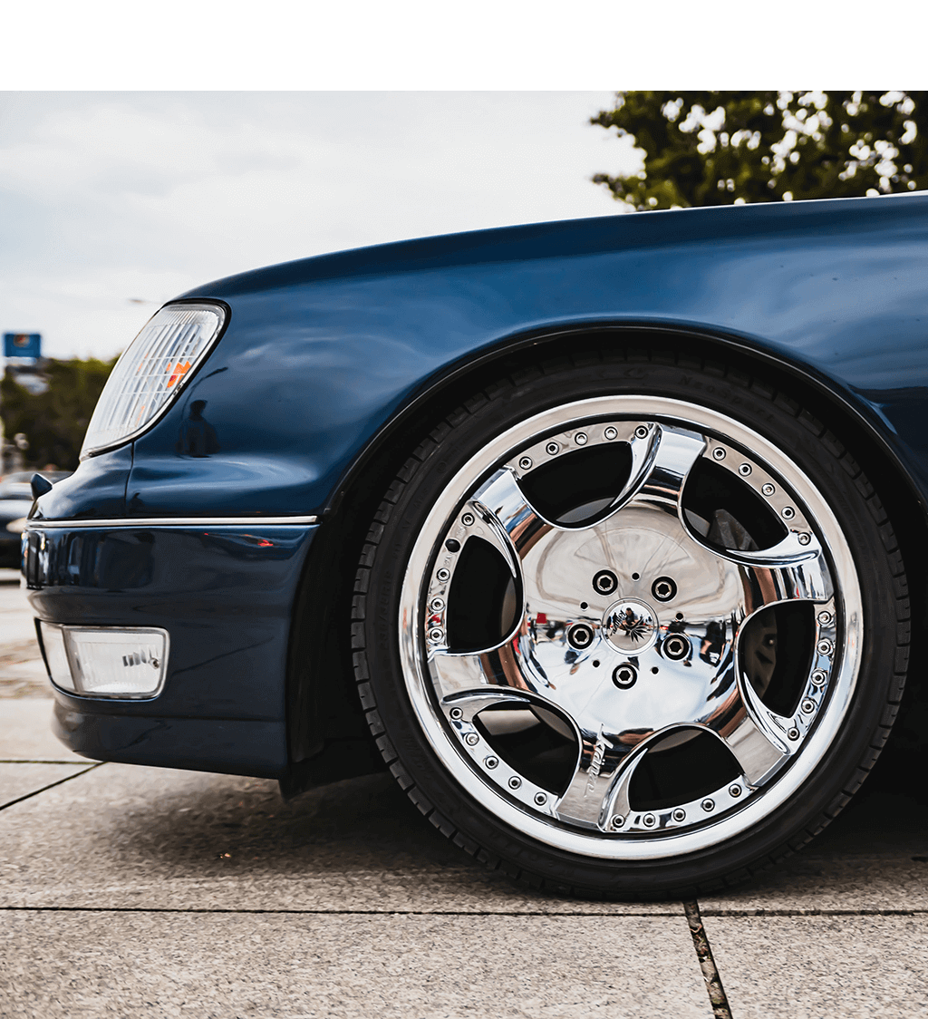 aftermarket wheels on a blue Lexus
