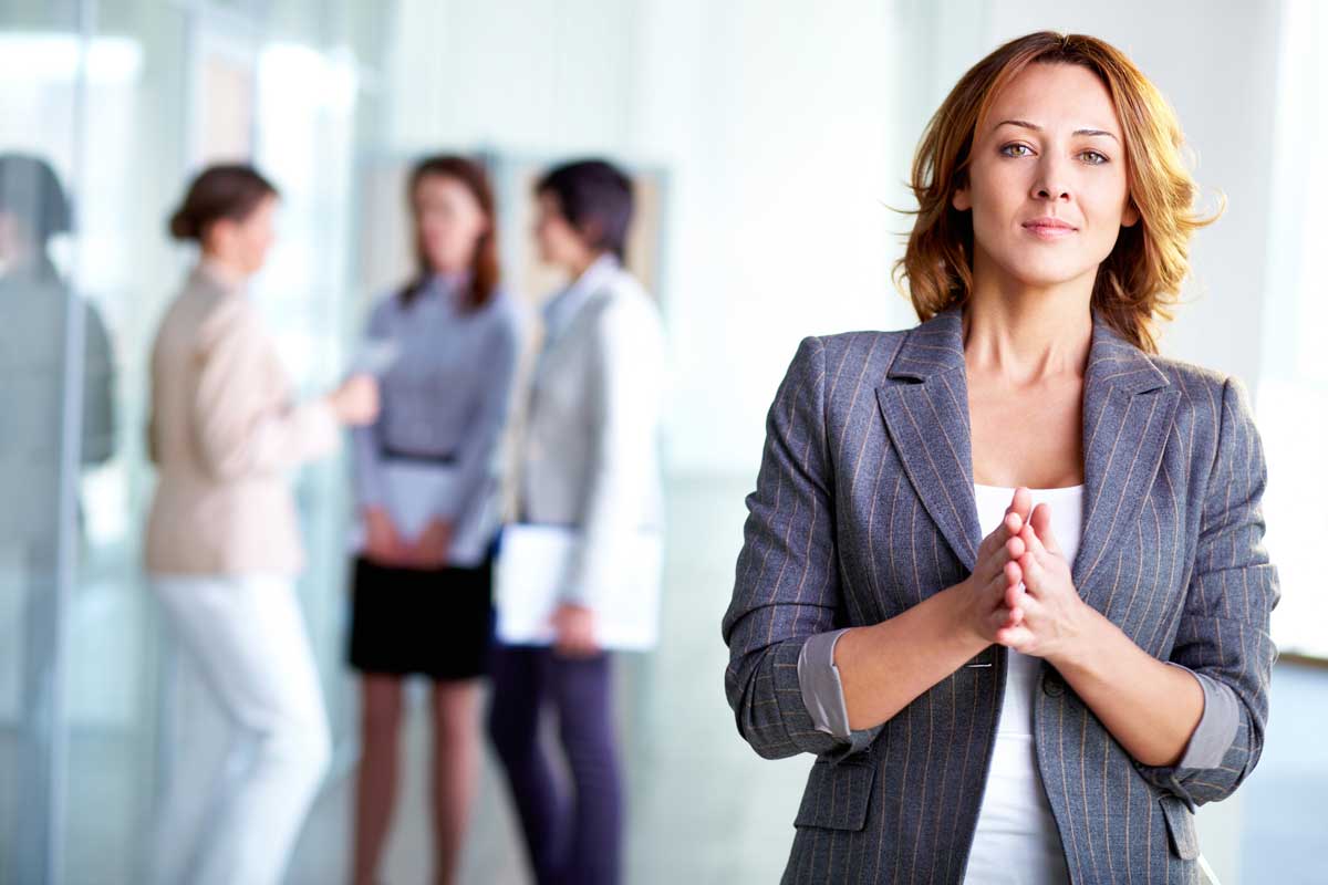 Business man and business woman  shaking hands in a meeting