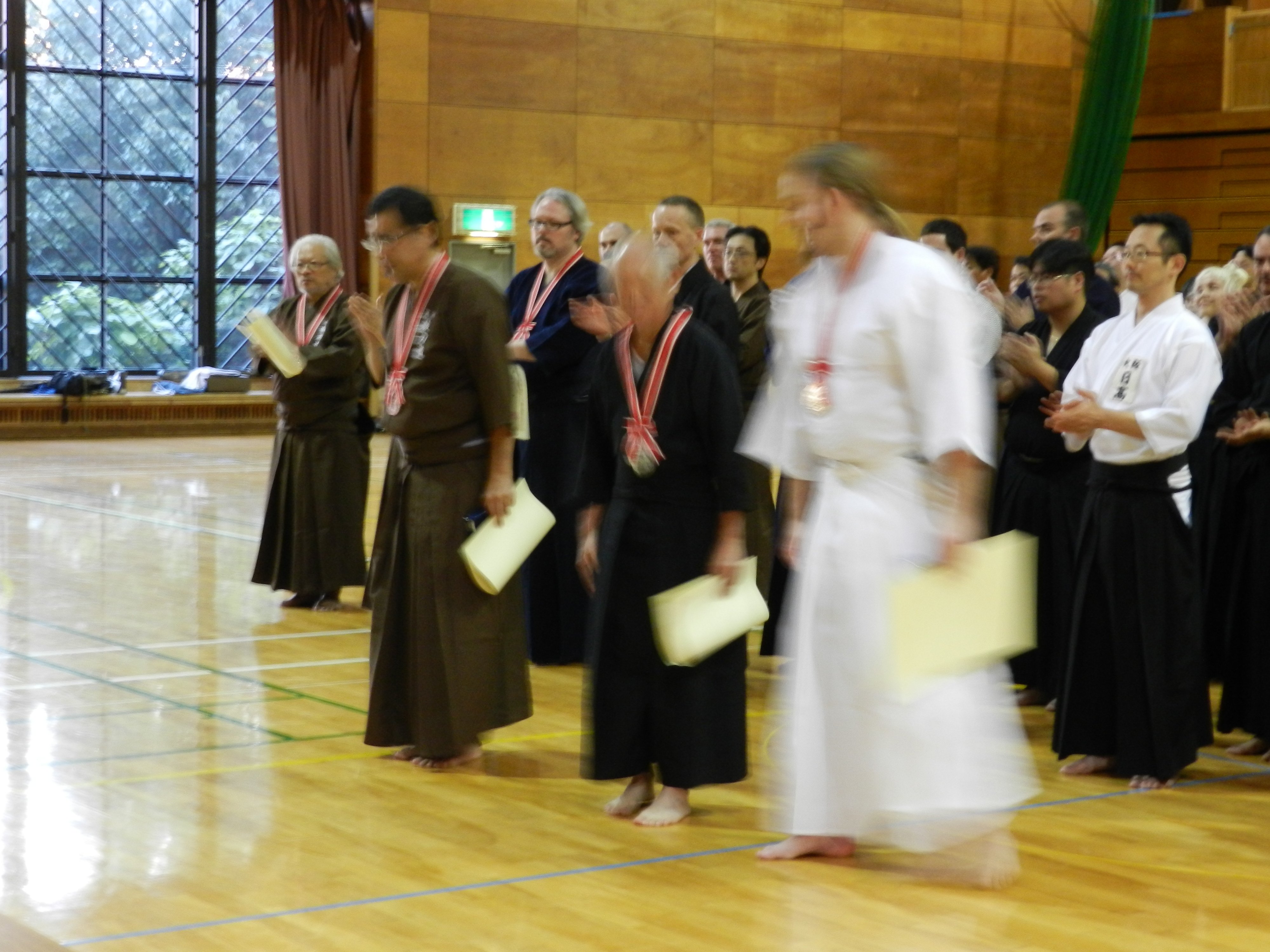 Award ceremony - Tex in the background with a 3rd place in Nidan and below kata.
