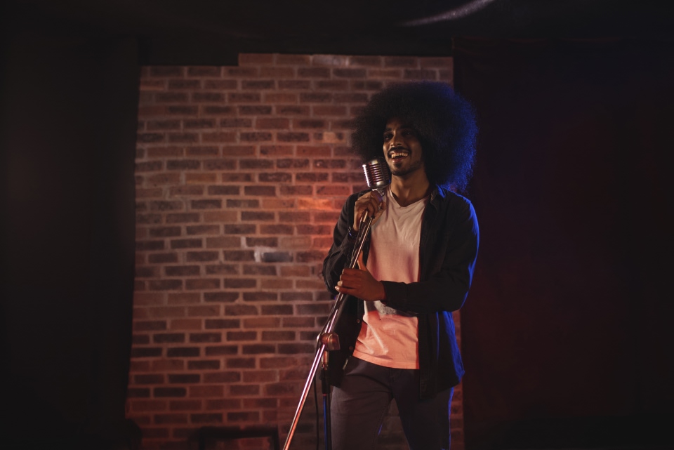 A woman performing into a microphone