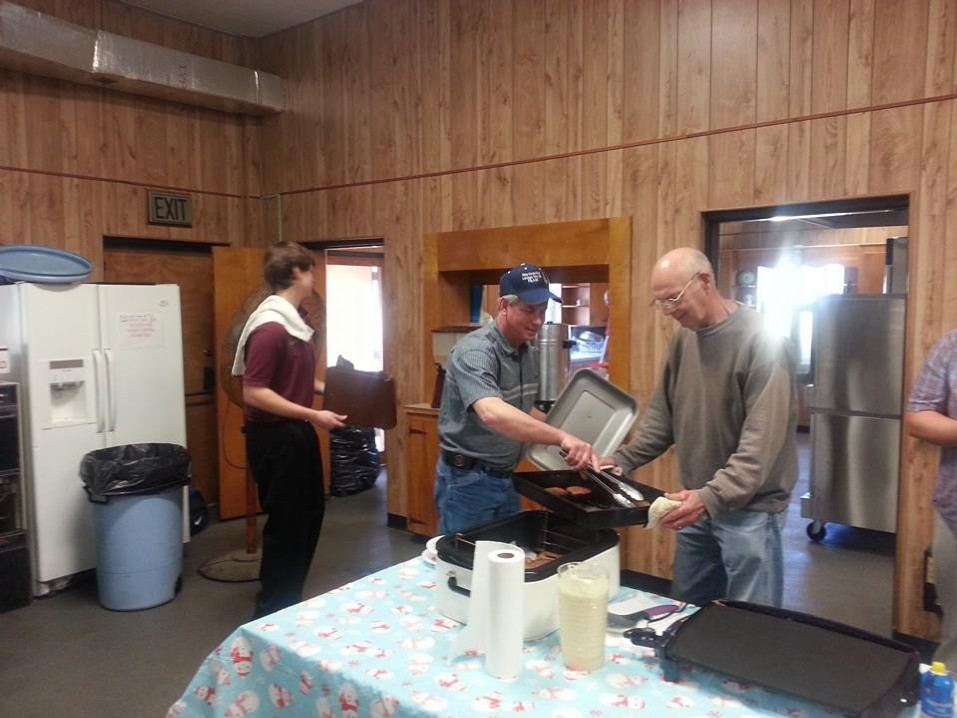 Brothers working at the Annual Pancake Breakfest