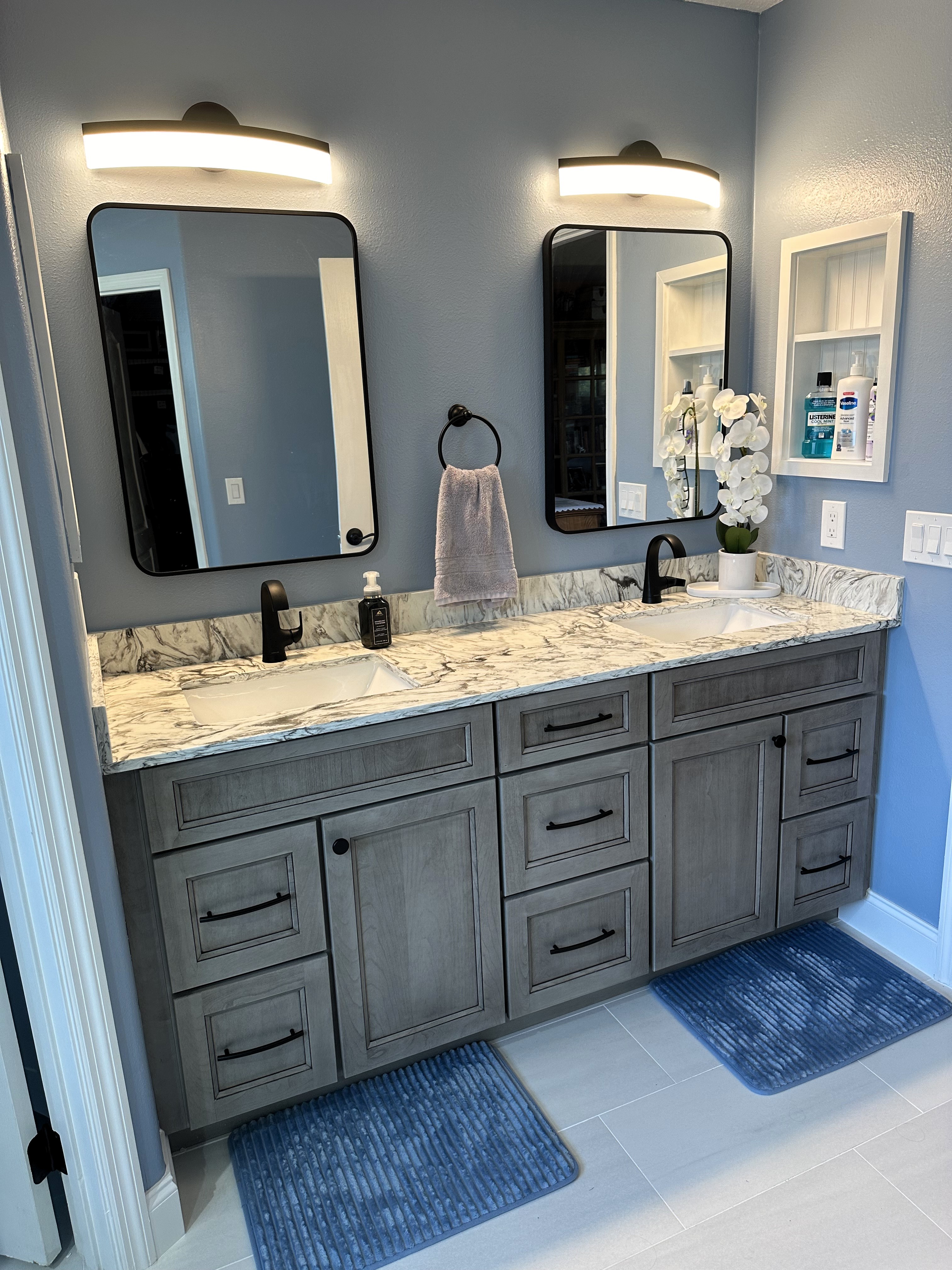 Perfectly placed custom built-in niche with shelf painted white for extra storage.