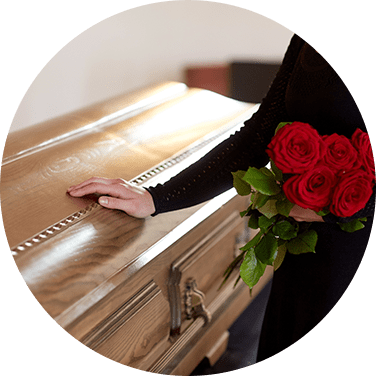 Woman With Red Roses And Coffin At Funeral