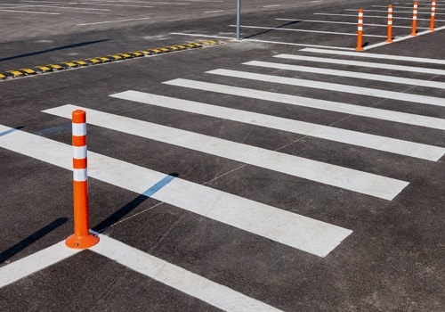 White Traffic Markings With A Pedestrian Crossing On A Gray Asph