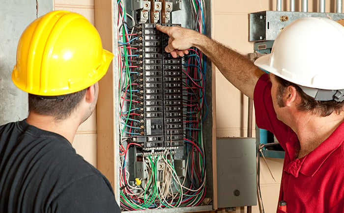 Professional Electricians Teaching to the Student