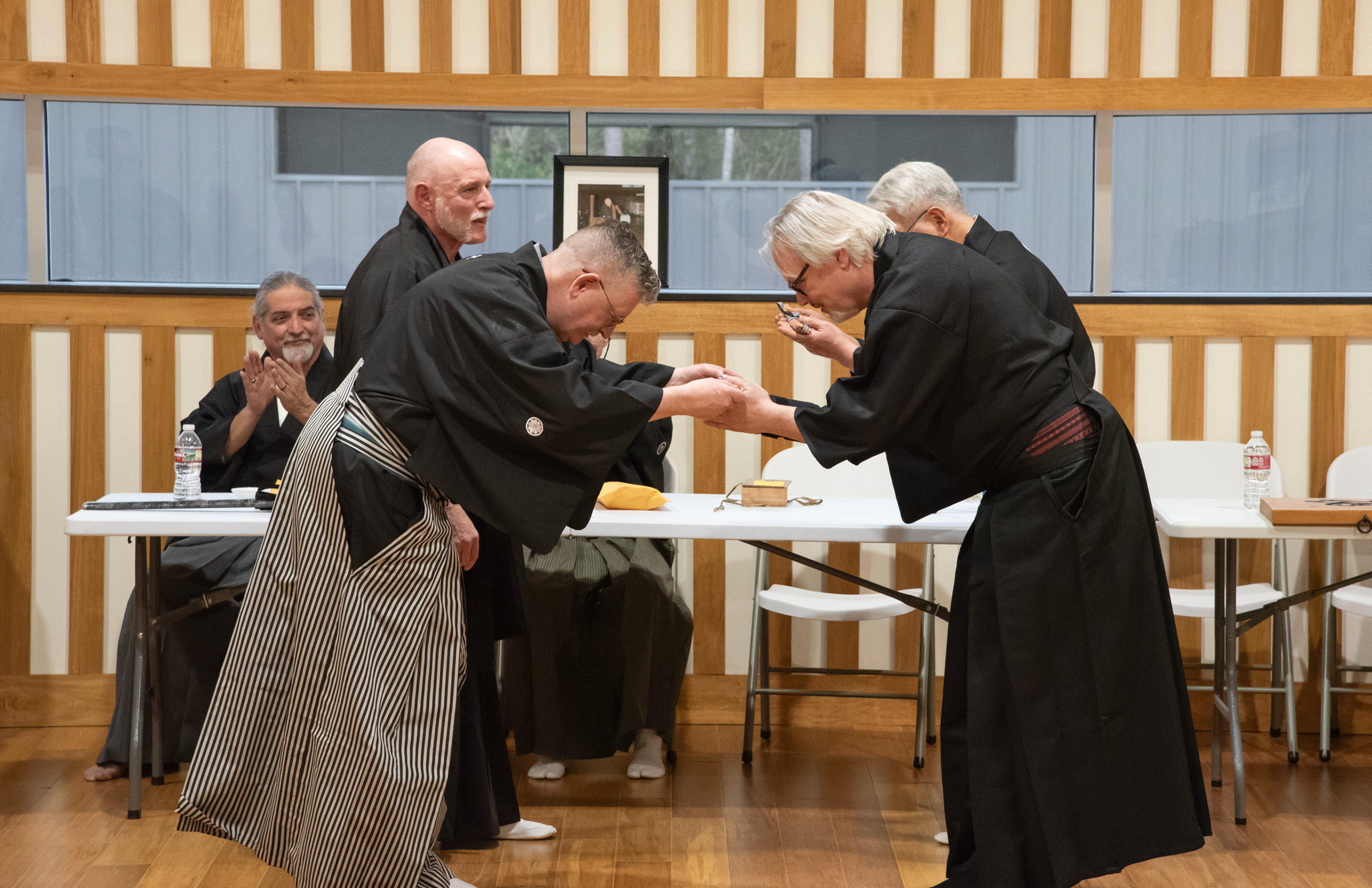 John M. receiving an iron tessen from Jeff Toms Sensei of the Mizu Hi Kobukai..