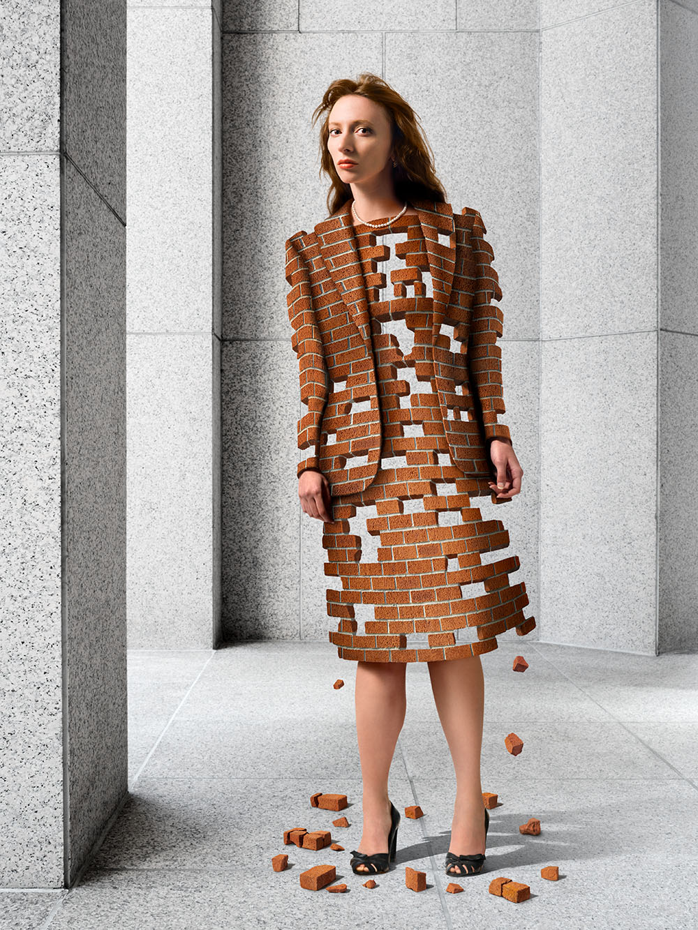 Surrealistic image of woman with a body made of bricks that are breaking apart.