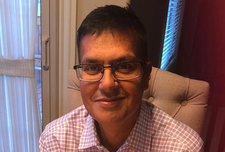 person holding two white tickets