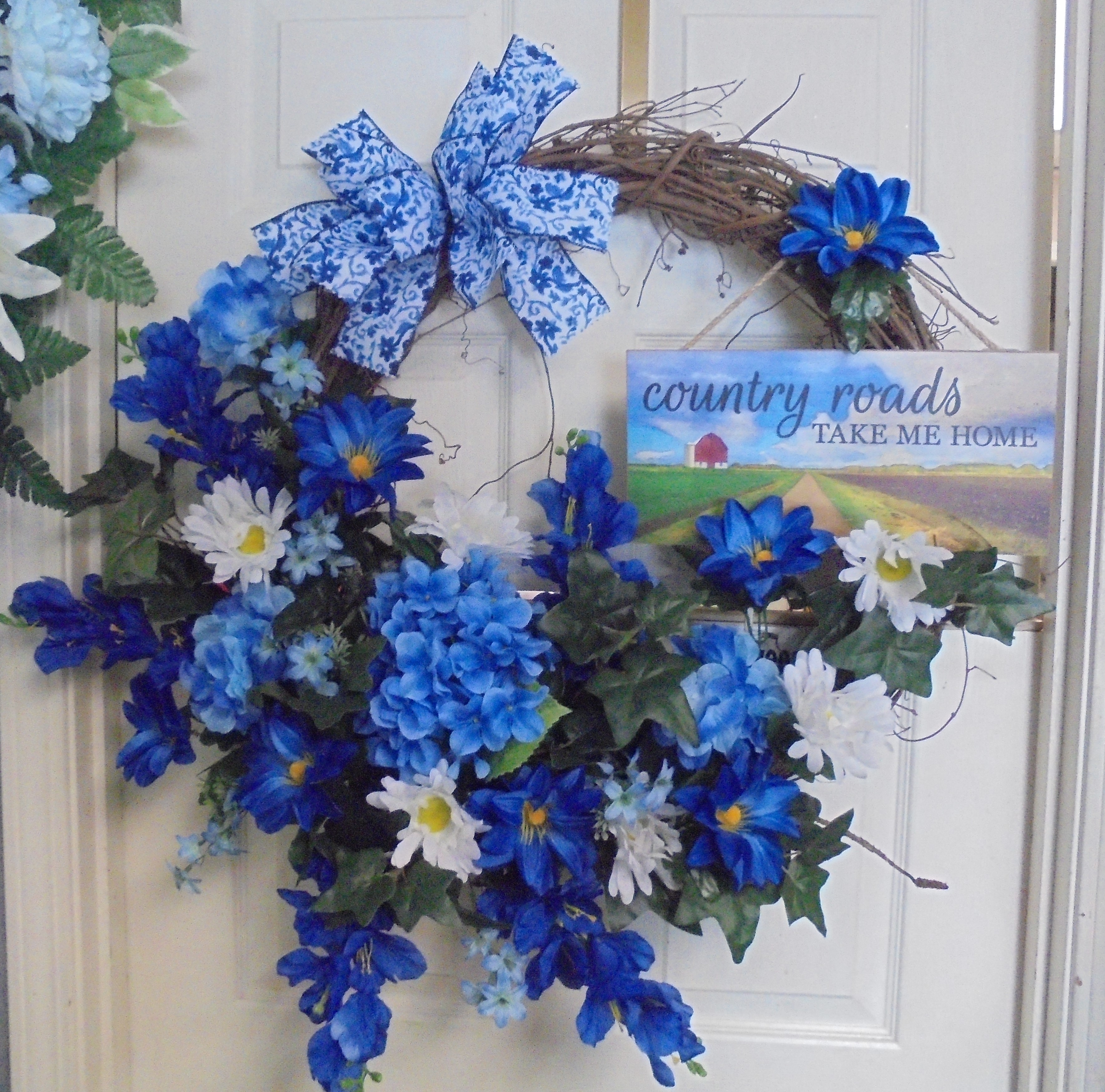 (30A) Grapevine Wreath
W/ Country Roads Take Me Home Plaque
$100.00