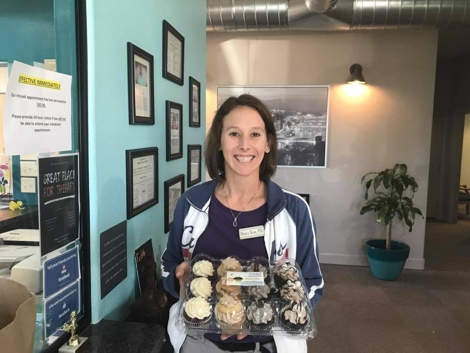 Woman With A Box Of Cupcakes