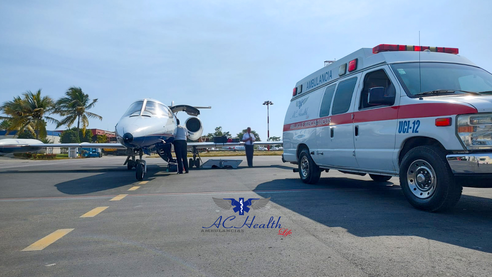 Doctors and patient smiling