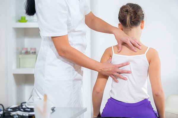 Chiropractor Doing Adjustment on Female Patient
