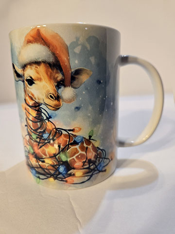 15oz ceramic mug featuring a giraffe in lights design