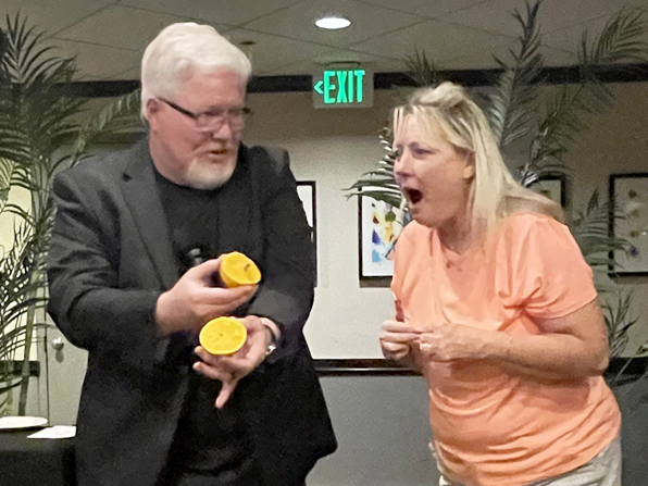 A guest reacts with amazement to Chuck's performance.