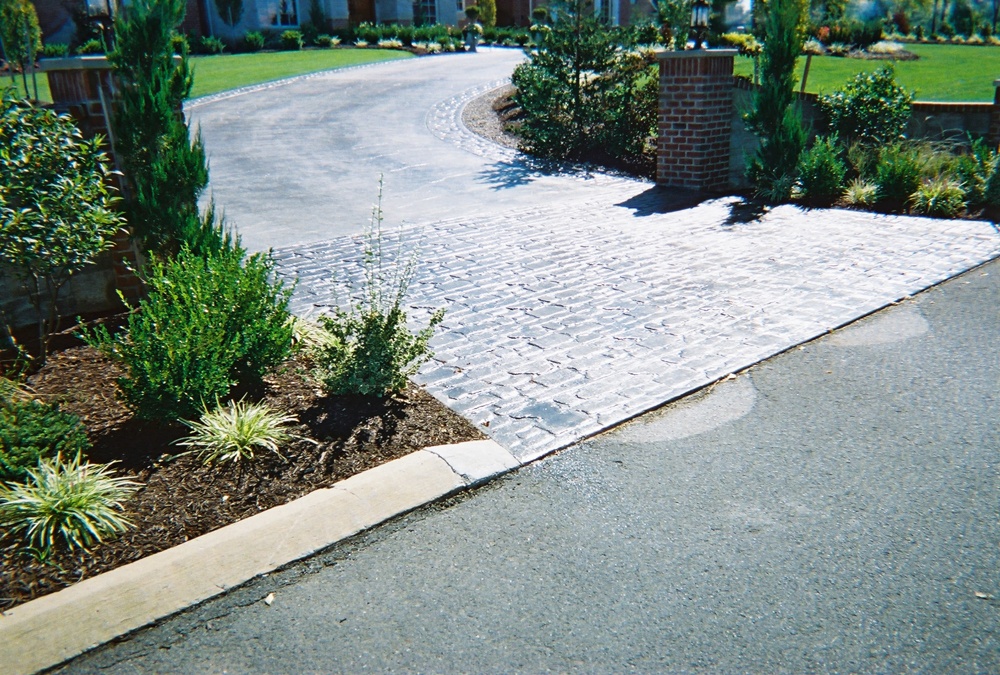 Random cobblestone and seamless slate driveway