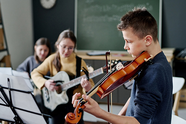 School Band Playing Music In Classroom