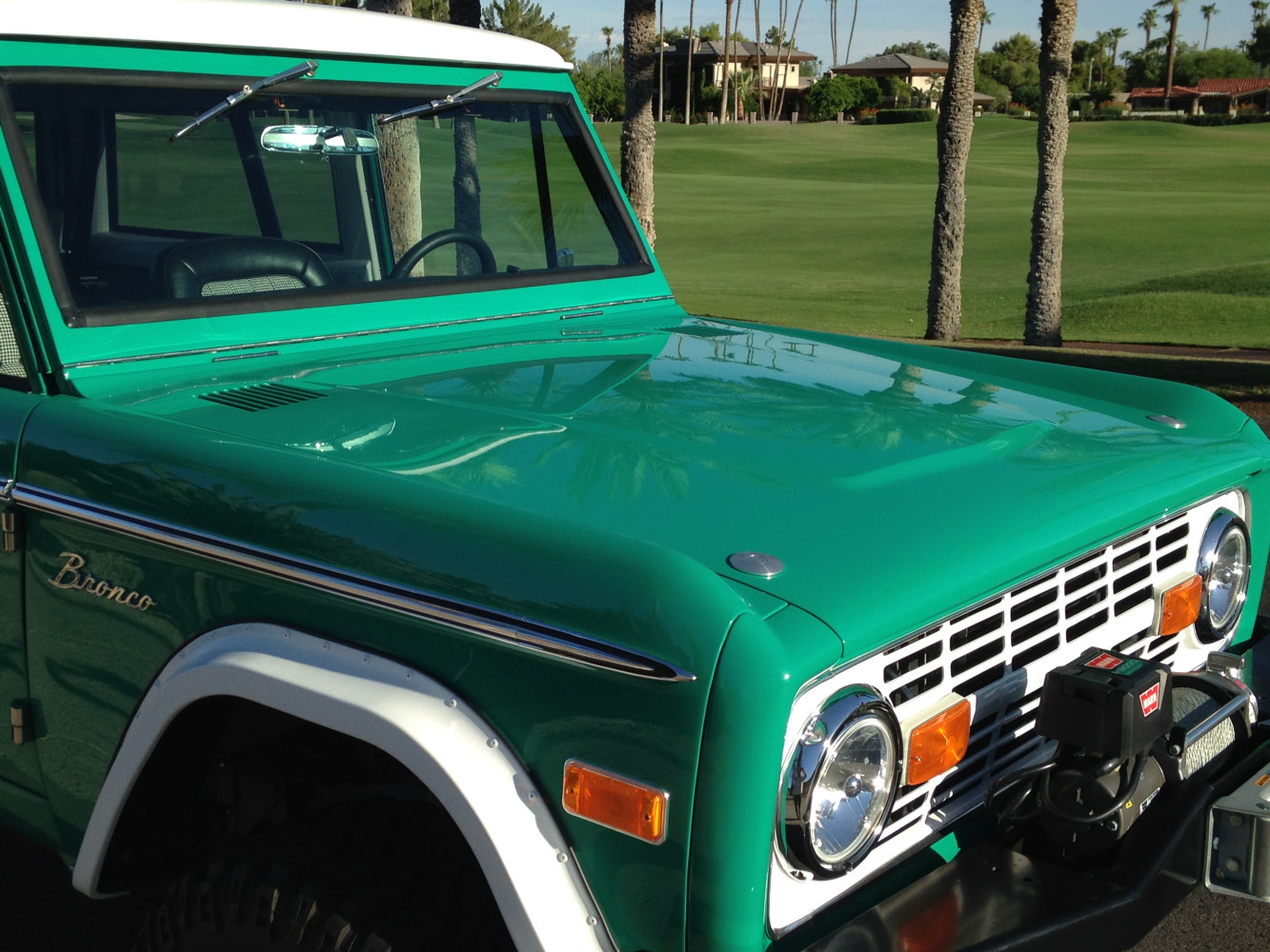 Low profile push button hood latches