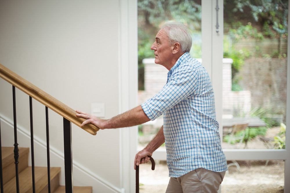 Senior Man at Bottom of Stairs