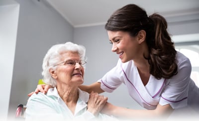 Smiling Nurse And Old Woman