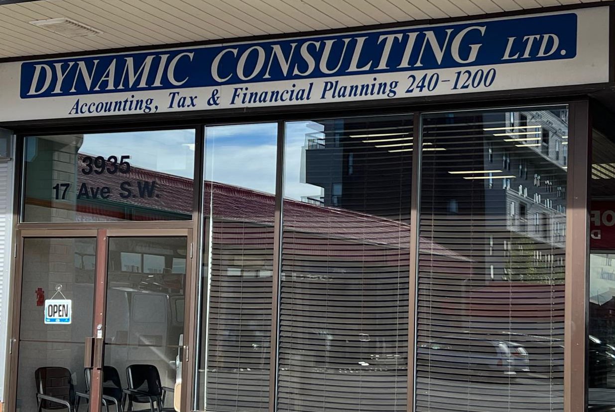 man in blue denim jacket facing turned on monitor