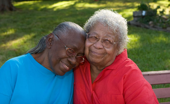 Happy Mature African American Sisters Laughing And Smiling