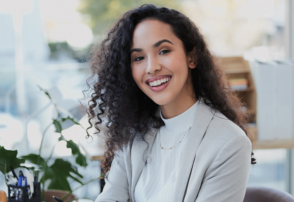 A woman outside and smiling