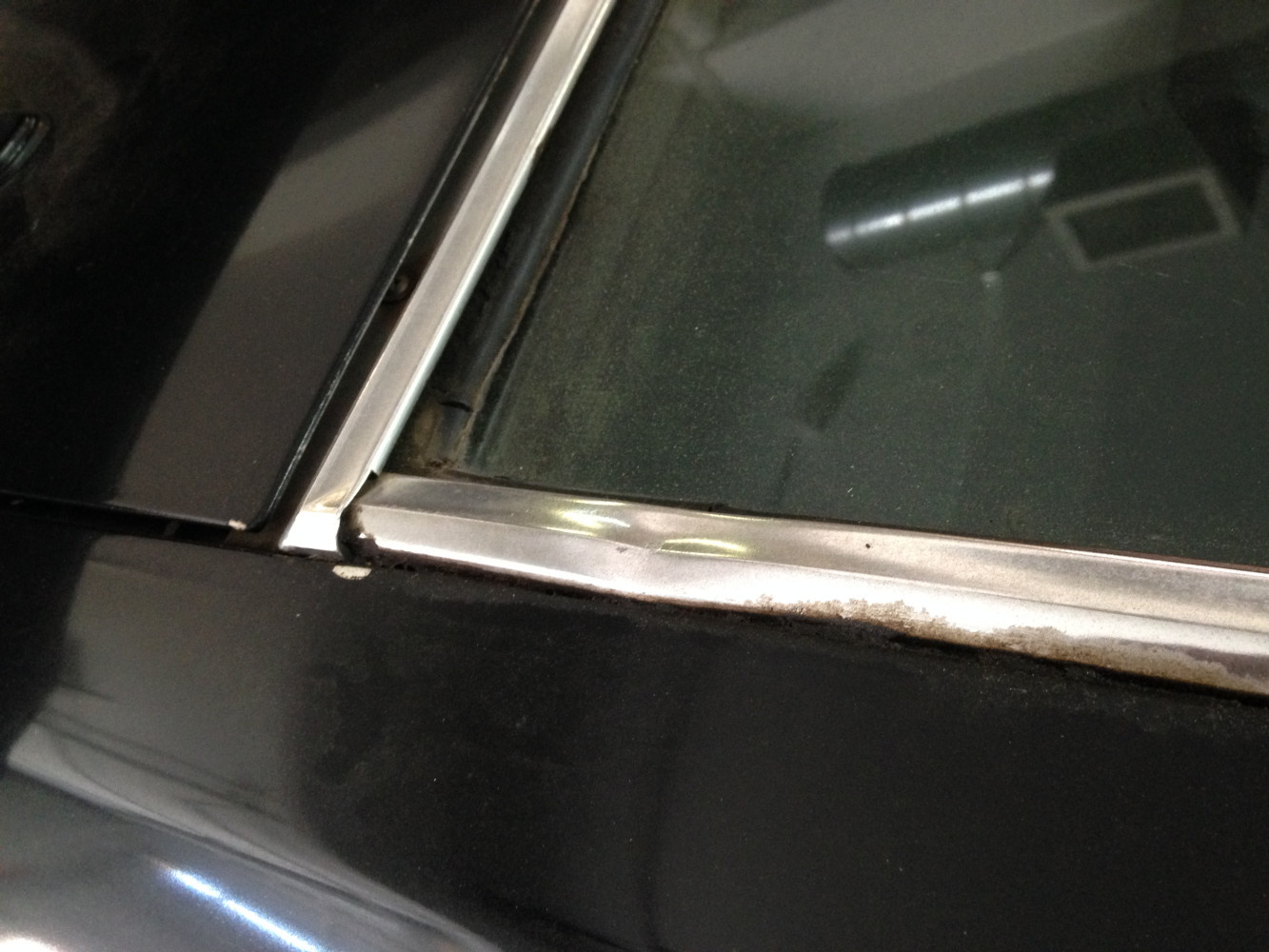 Damaged window molding. Hopefully this can be
straightened out  polished and reused.