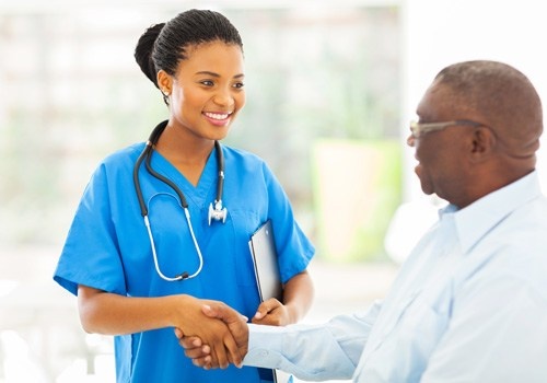 Nurse Handshaking with Senior Patient