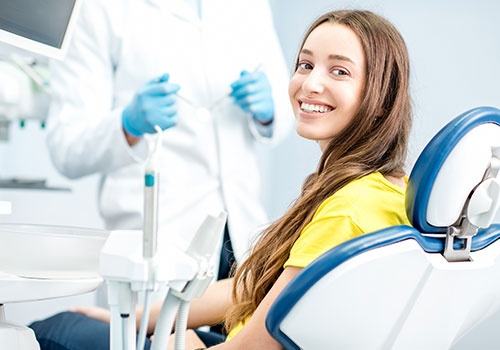 woman  Sitting At The Dental Chair