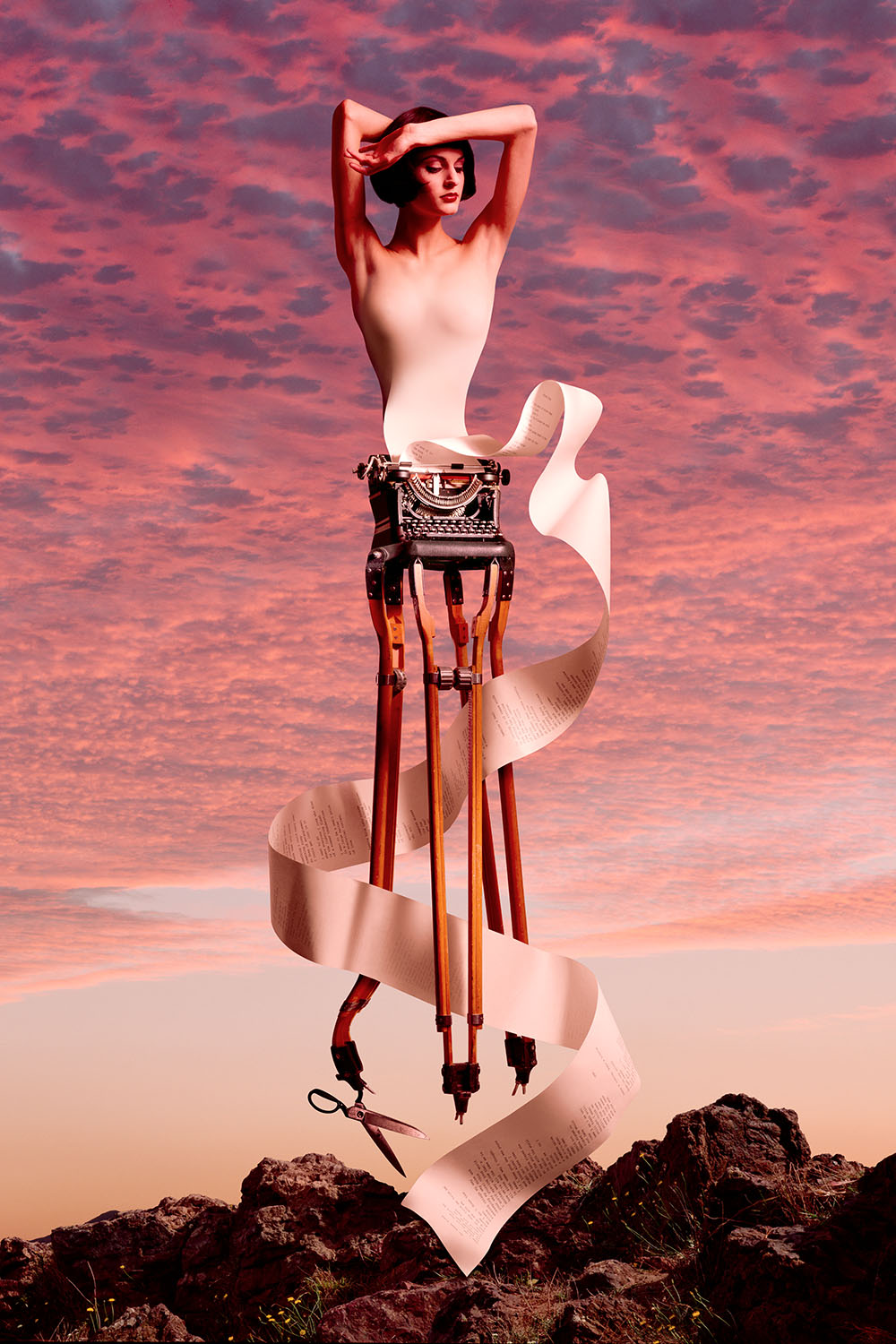 Surreal image of woman turning into paper being fed into a vintage typewriter, which sits on an old wooden tripod.