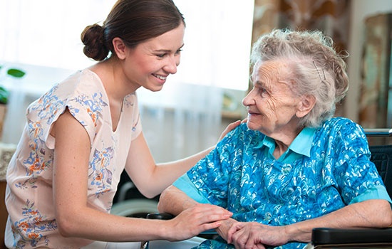 Senior Woman With Her Home Caregiver