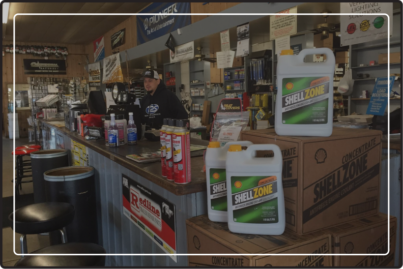 Truck Parts and Service Company’s front counter with an employee standing behind it.