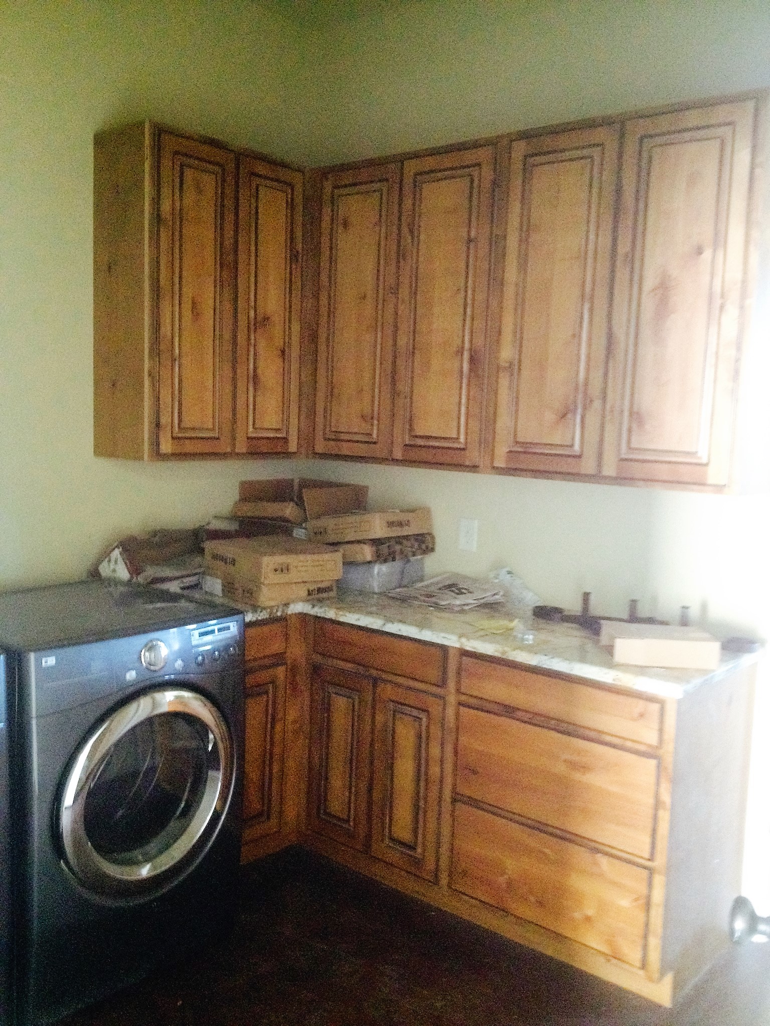 Cabinets feature Knotty Alder with golden
 oak stain and Walnut Glaze, Raised Panel Doors,
 and 42" upper cabinets