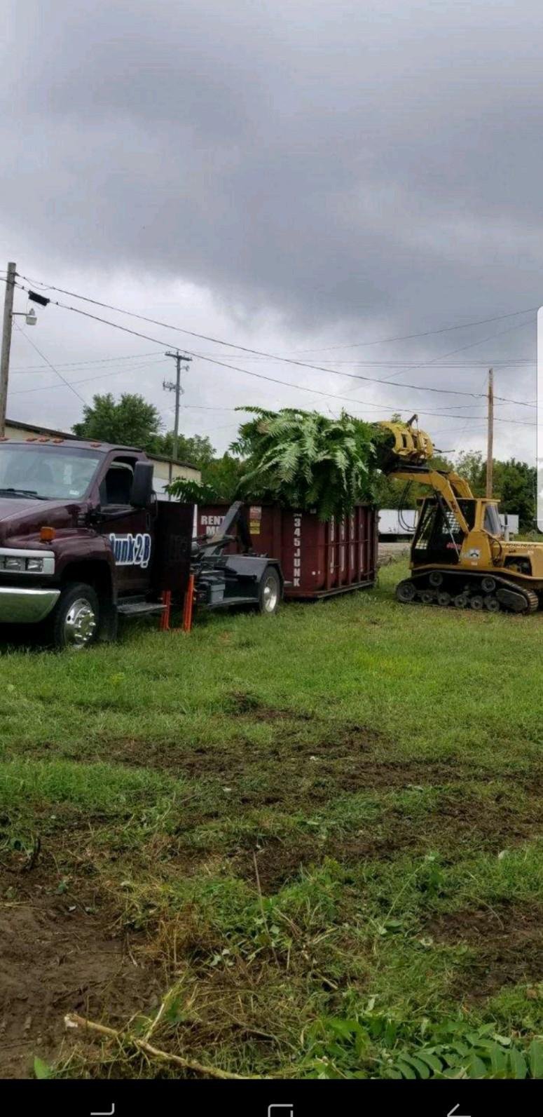 Junk2B dumpsters with loader