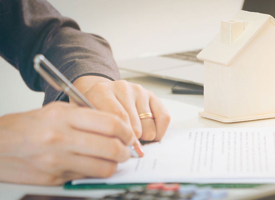 Client Signs Document to Buy House and Real Estate