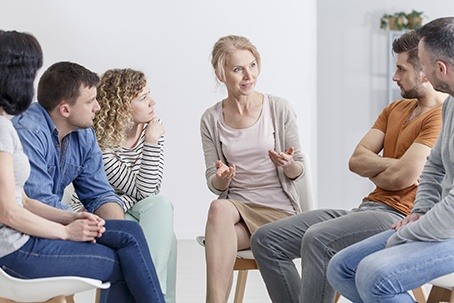 Psychologist Encouraging her Group