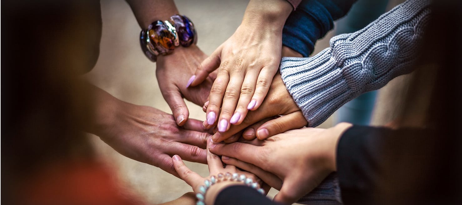 Group of hands meeting in the middle Group of hands meeting in the middle
