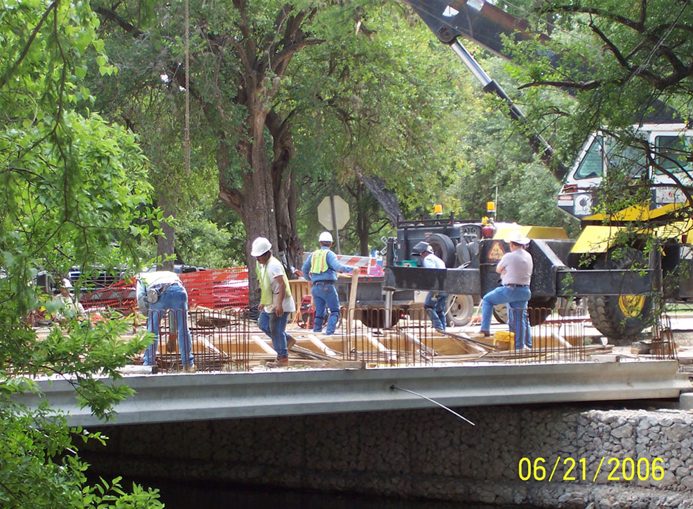 Construction crew working on Landa Park Bridge.