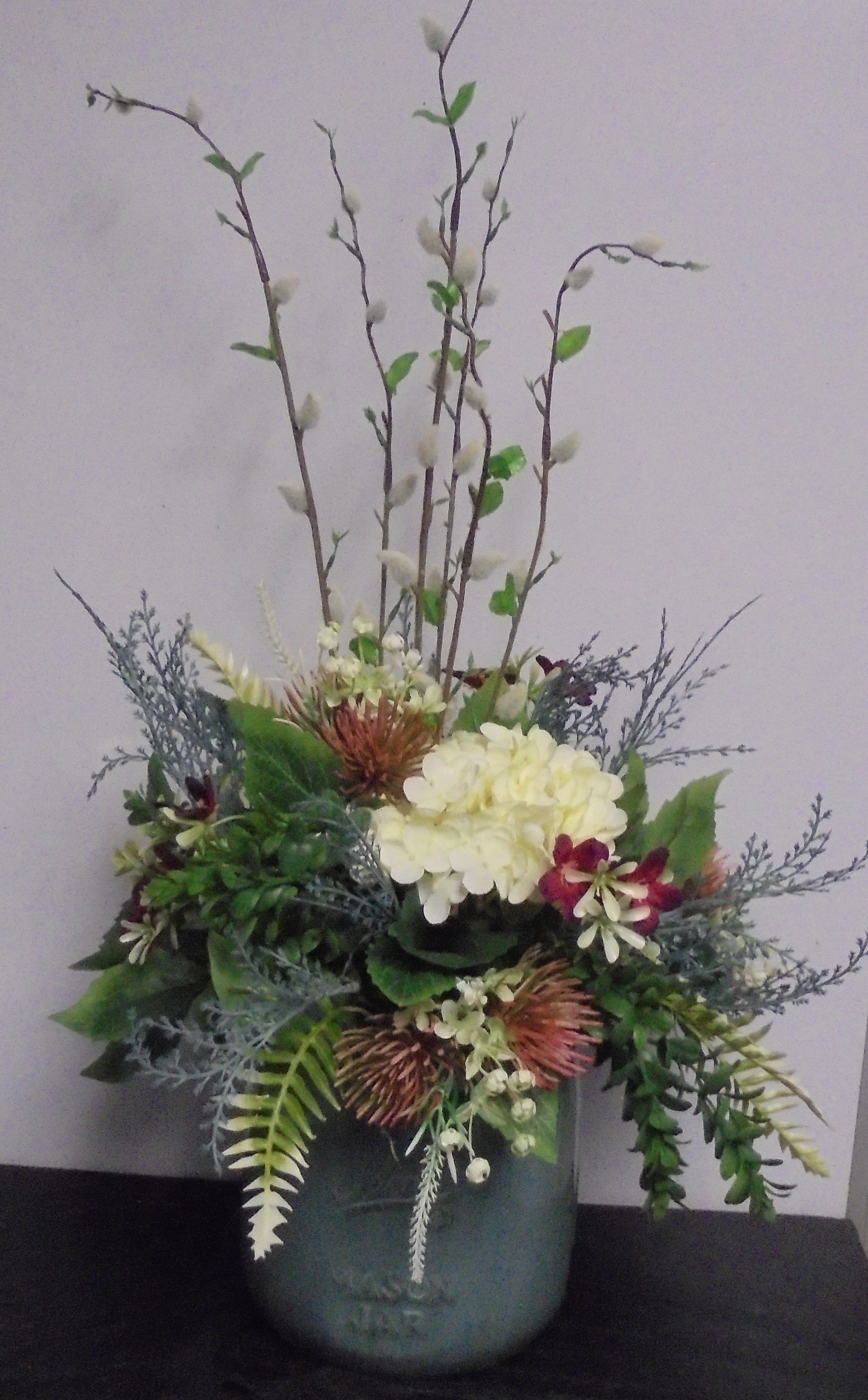 (40) "Silk" Mason Jar  Arrangement
(Teal, Cream & Mauve)
$65.00
