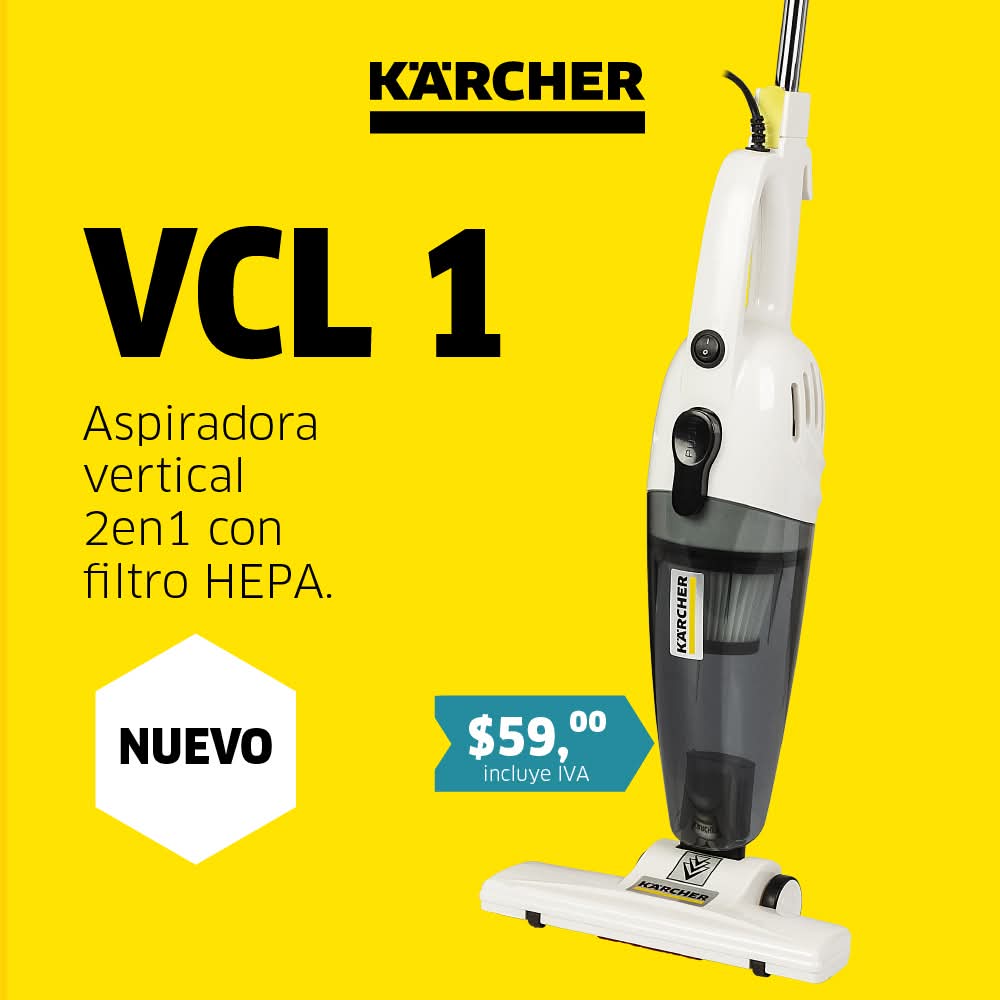 Aspiradora azul en oficina moderna con suelo brillante y plantas decorativas.