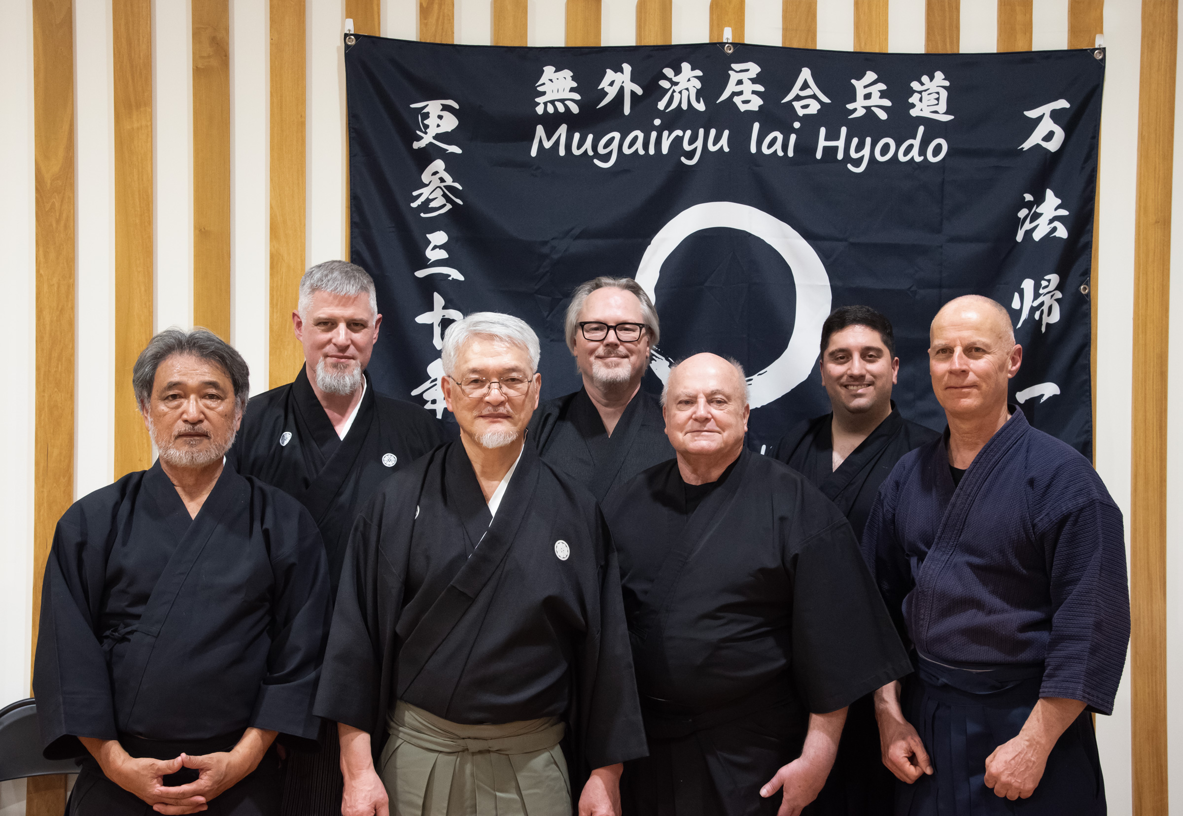Members of Yokohama Mugaikai - left to right - Yoshitaka Satoh (San Diego), Kurt Brown (Washington D.C.), Nomura Sensei (Yokohama), John Mutschink (Magnolia/The Woodlands), Derek Weaver (Washington D.C.), Keyan Jafari (San Diego), Yilmaz Karadeniz (London/Turkey).