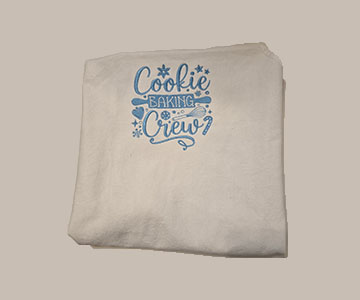 Embroidered cookie baking crew in blue on white youth apron