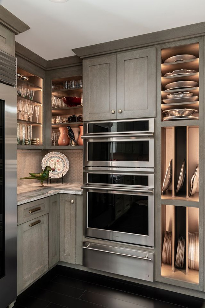 Butlers Pantry with LED lighted quartersawn oak cabinets, Cambria quartz countertop, and terracotta Moroccan backsplash tile