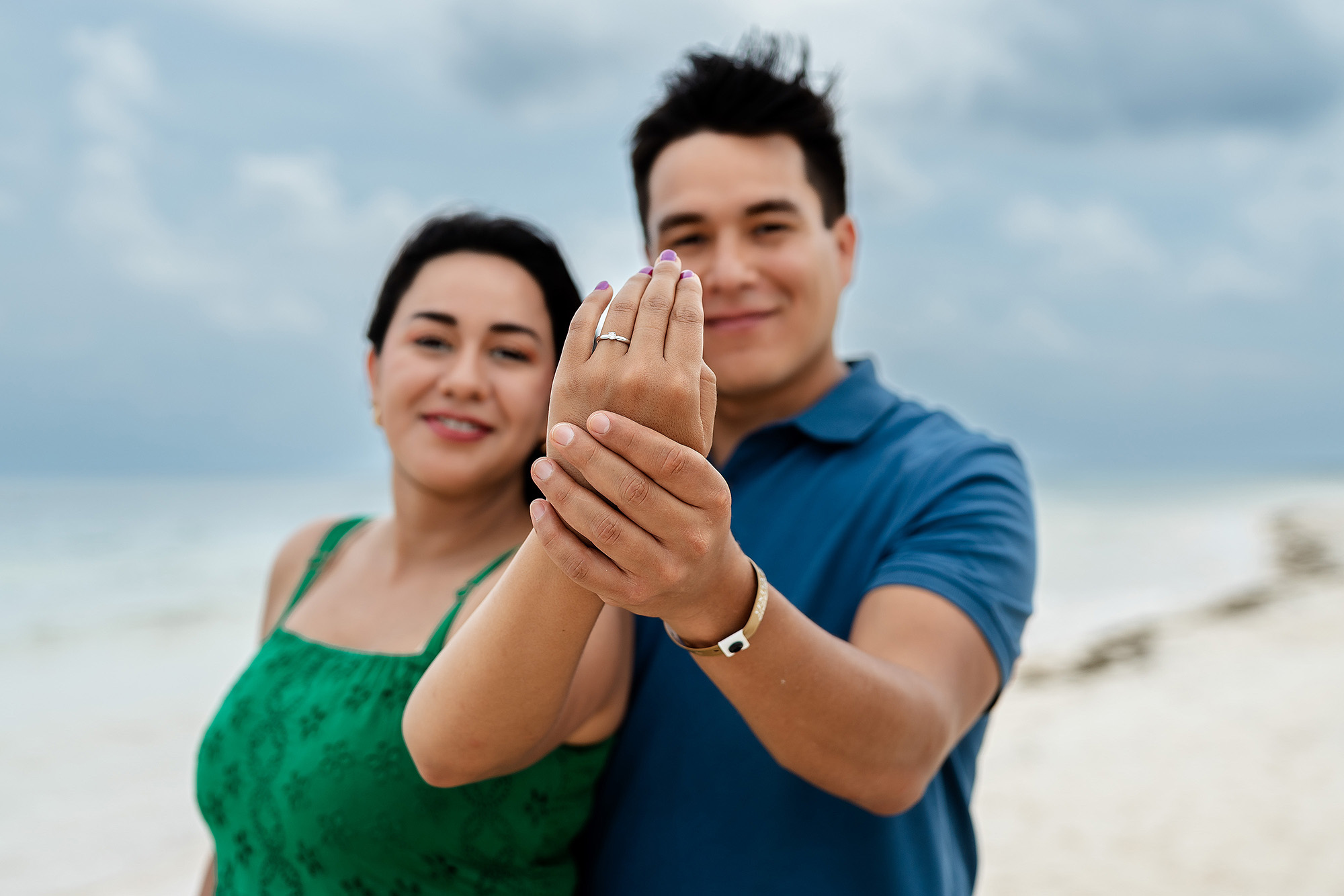 Engagement ring detail during a beach proposal in Puerto Morelos, Mexico.