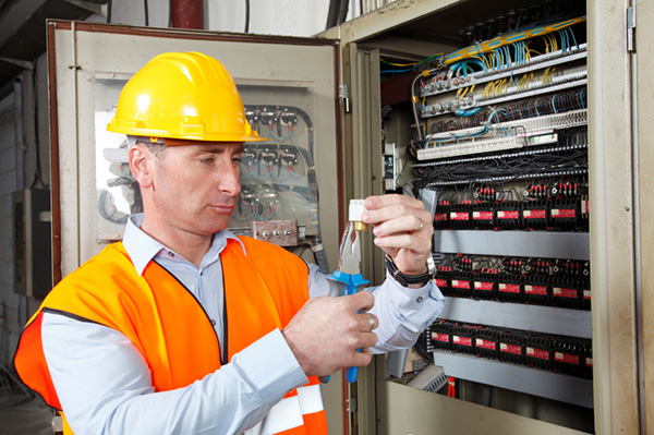 Electricians working on circuit breaker