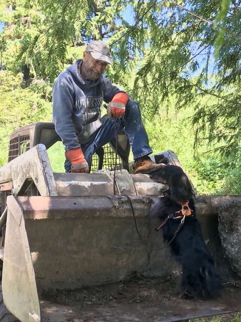 Marcus Hayduk and Auggie on site with Bulldozer